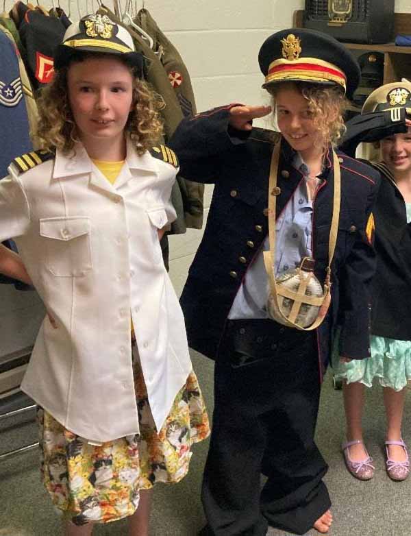 young visitors to the museum wearing military outfits